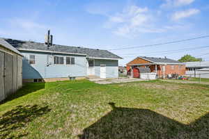 Back of house featuring a patio and a shingled roof