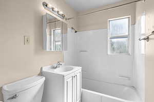 Bathroom featuring vanity and shower / tub combination