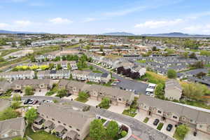 Aerial view of residential area featuring a mountainous background