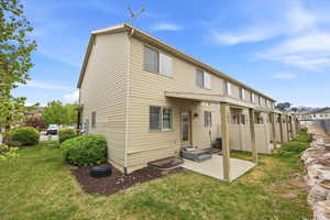 Rear view of property with a patio and a residential view