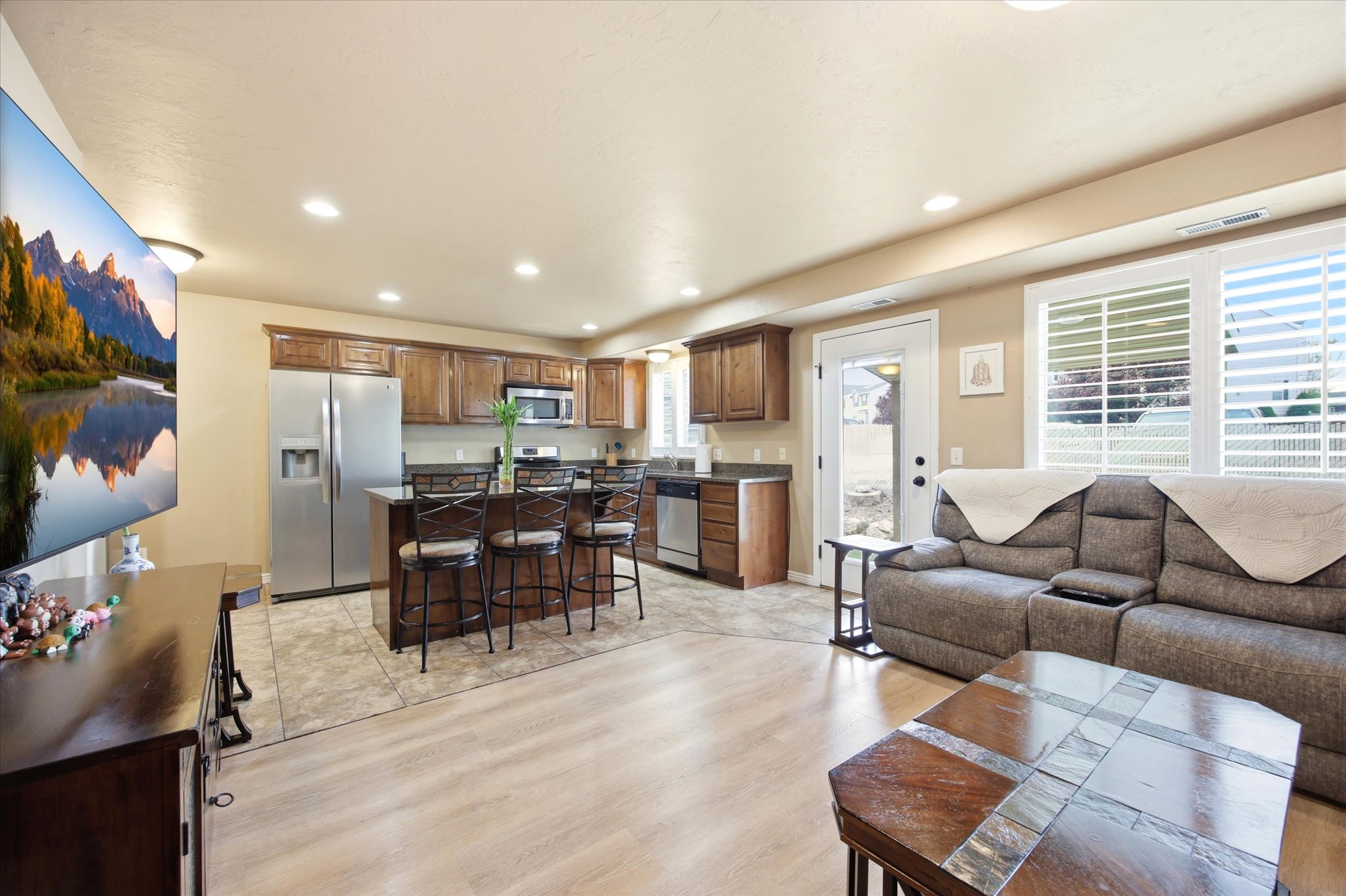 Living area with recessed lighting and light wood finished floors