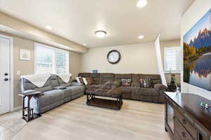 Living area featuring recessed lighting and light wood finished floors