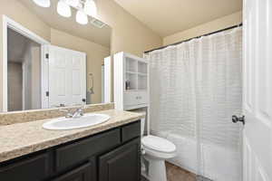 Full bathroom with vanity and shower / tub combo