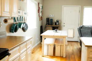 Office space with light wood-style floors and baseboards