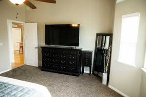 Bedroom featuring light colored carpet and a ceiling fan