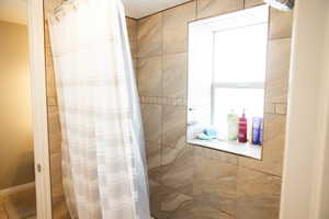 Bathroom with tiled shower