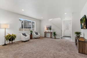 Sitting room featuring carpet floors and recessed lighting