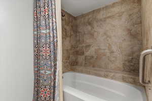 Full bathroom with shower / tub combo