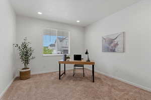 Office space featuring light carpet and recessed lighting