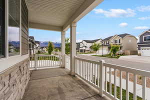 Covered porch with a residential view