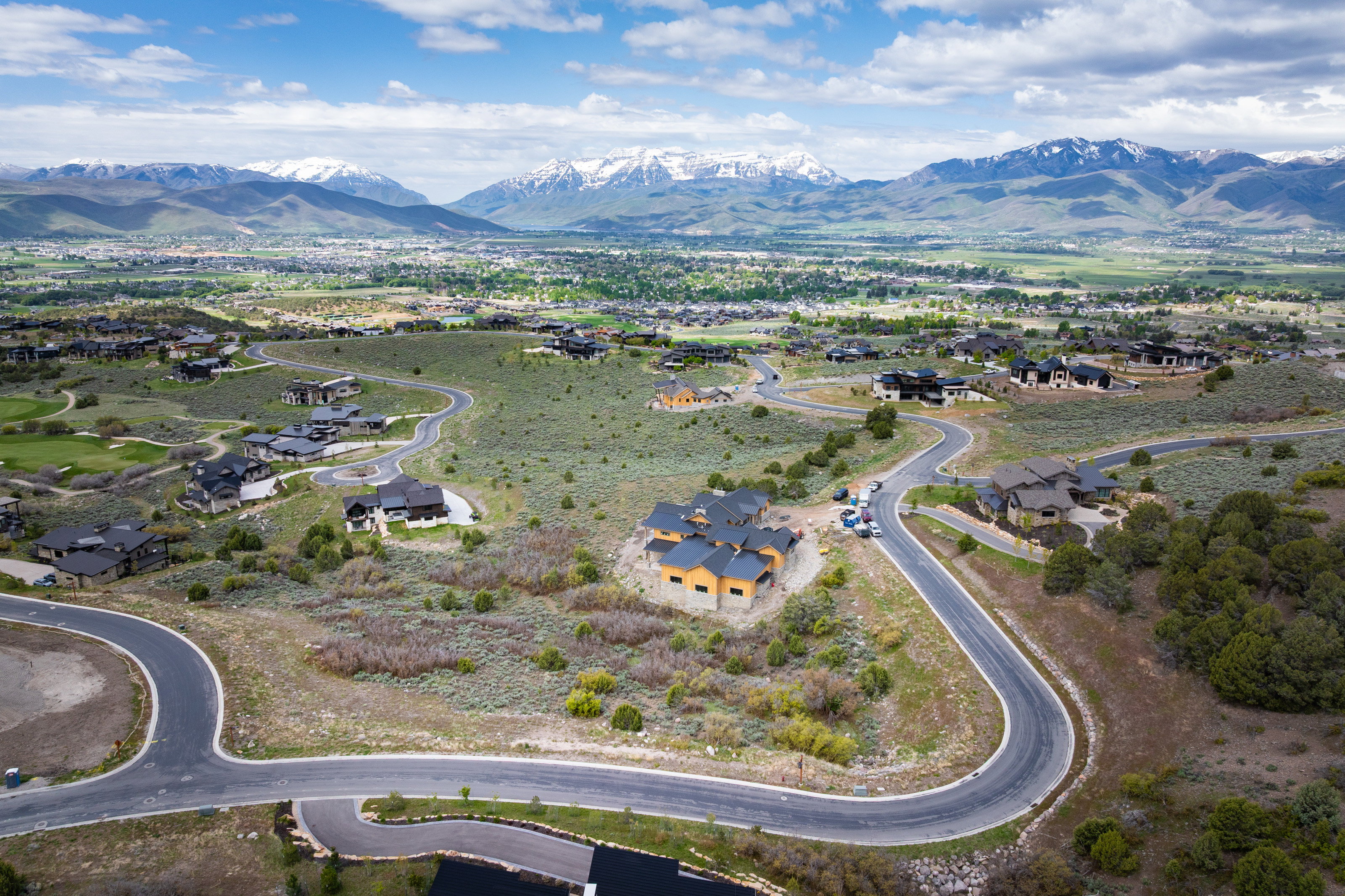 View of property location with mountains and nearby suburban area