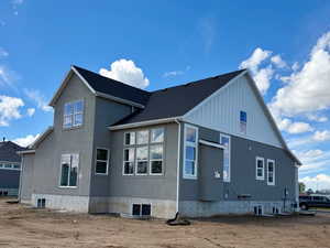 View of home's exterior with board and batten siding and stucco siding