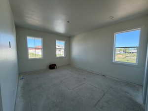 Empty room featuring baseboards