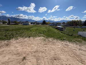 View of mountain backdrop with rural landscape