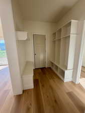 Mudroom with light wood-style flooring