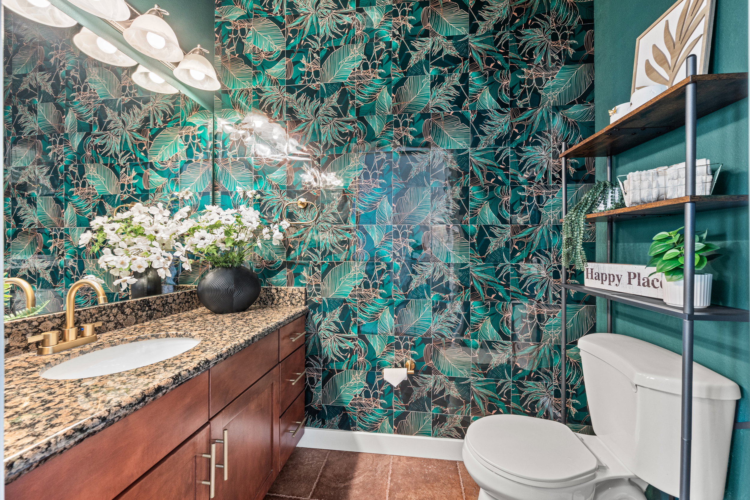 Half bath with wallpapered walls and vanity