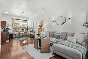 Living area with wood finished floors and a textured ceiling