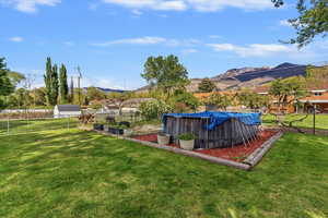 View of fenced backyard