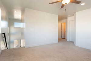Unfurnished room with recessed lighting, light colored carpet, and a ceiling fan