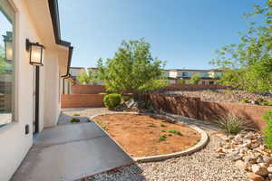 Fenced backyard with a patio area