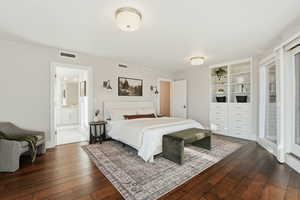 Bedroom with dark wood-style floors