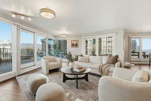 Living area featuring a mountain view and wood finished floors