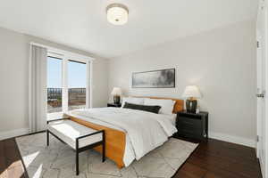 Bedroom with access to exterior and wood-type flooring