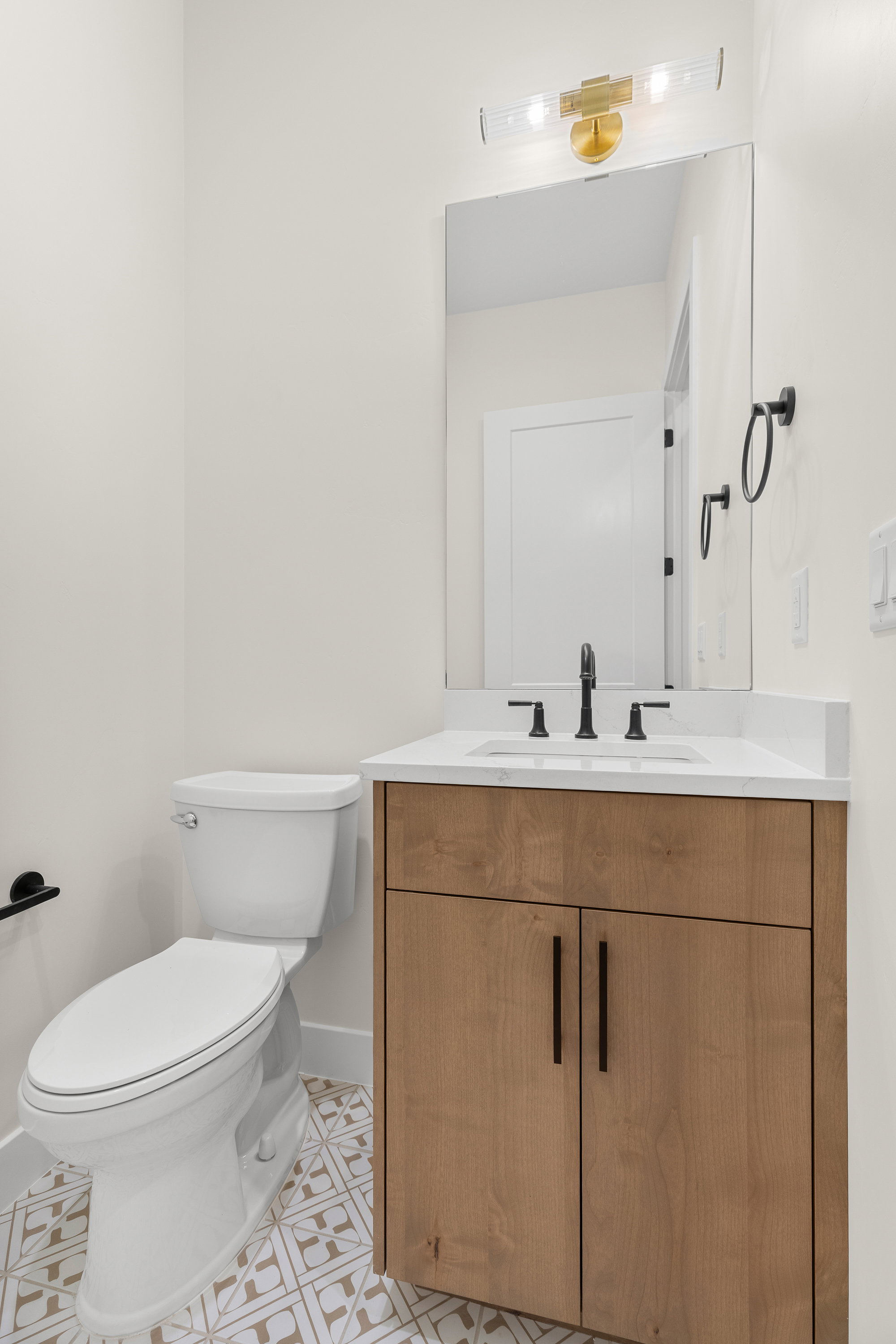 Half bath with vanity and toilet