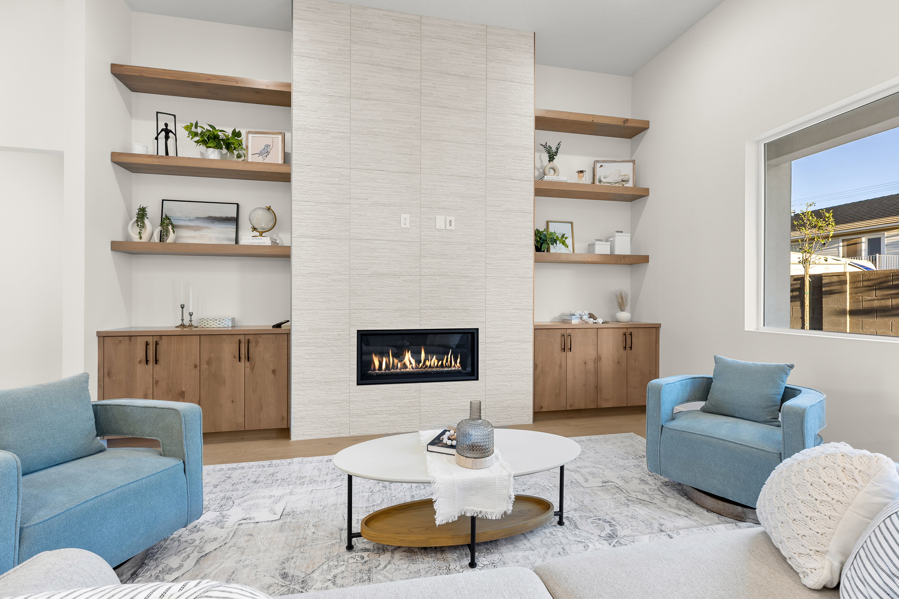 Living room with wood finished floors and a fireplace