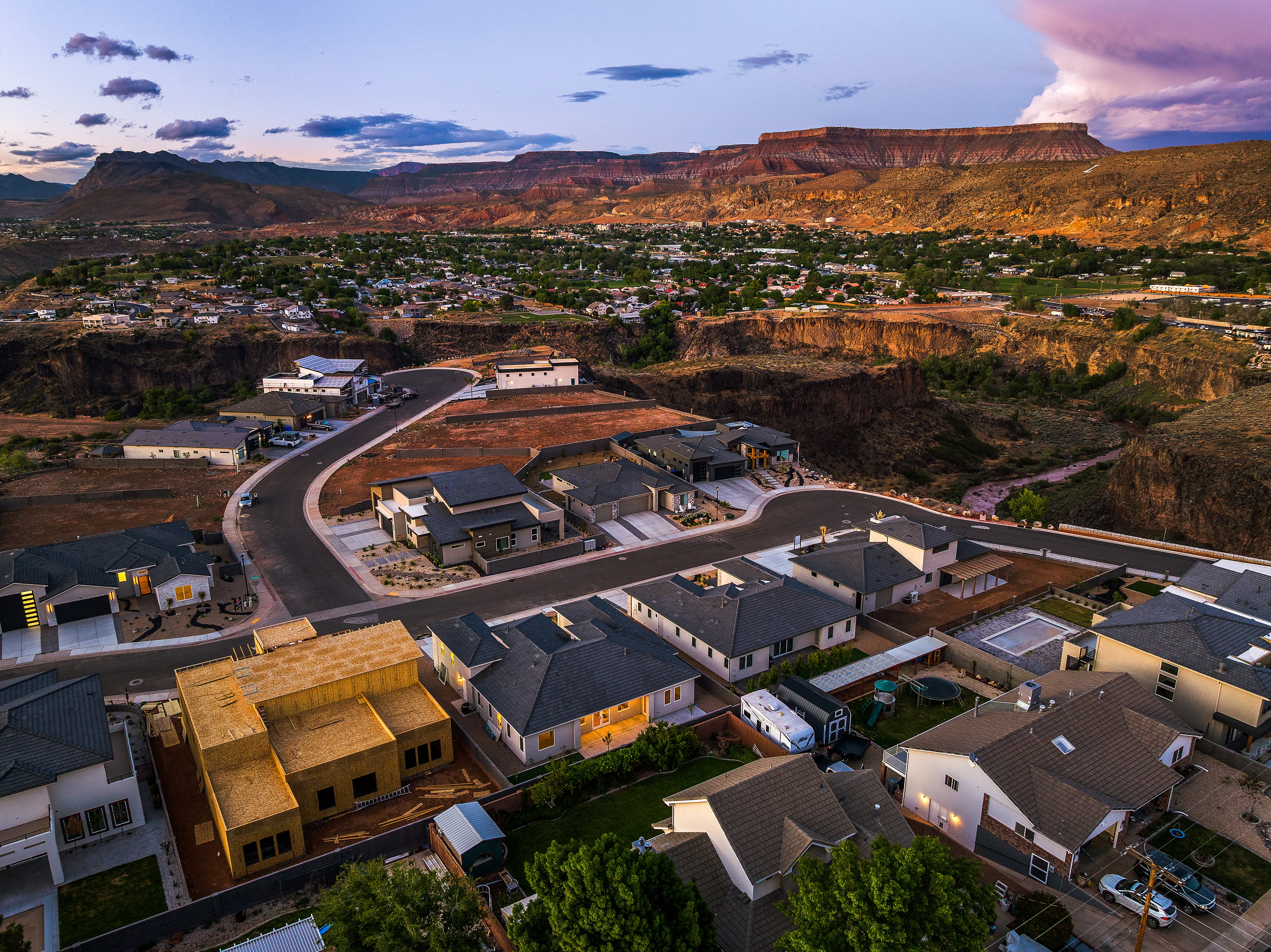 Aerial view at dusk of a residential view and a mountain view
