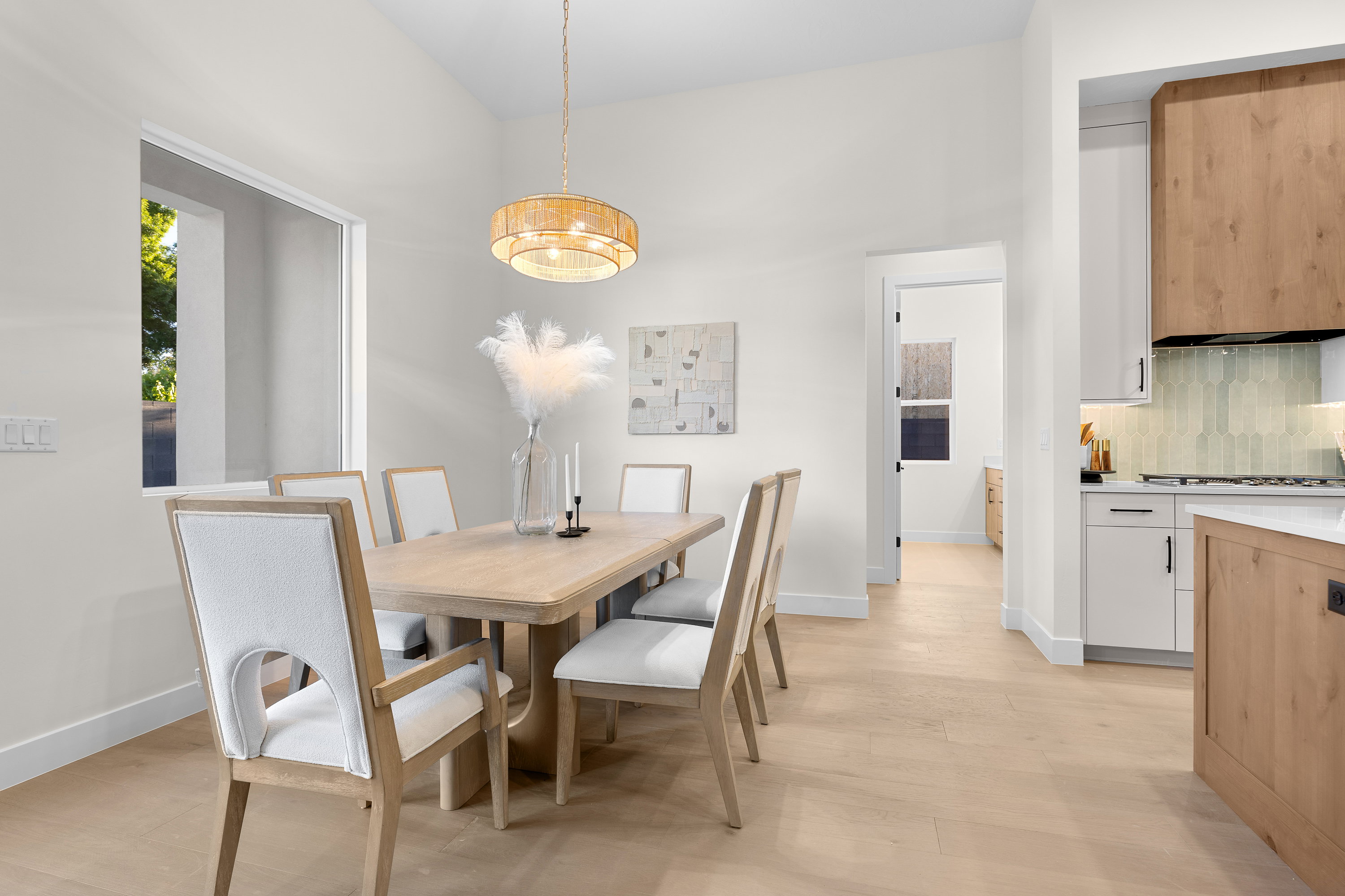 Dining room featuring light wood-style flooring and baseboards