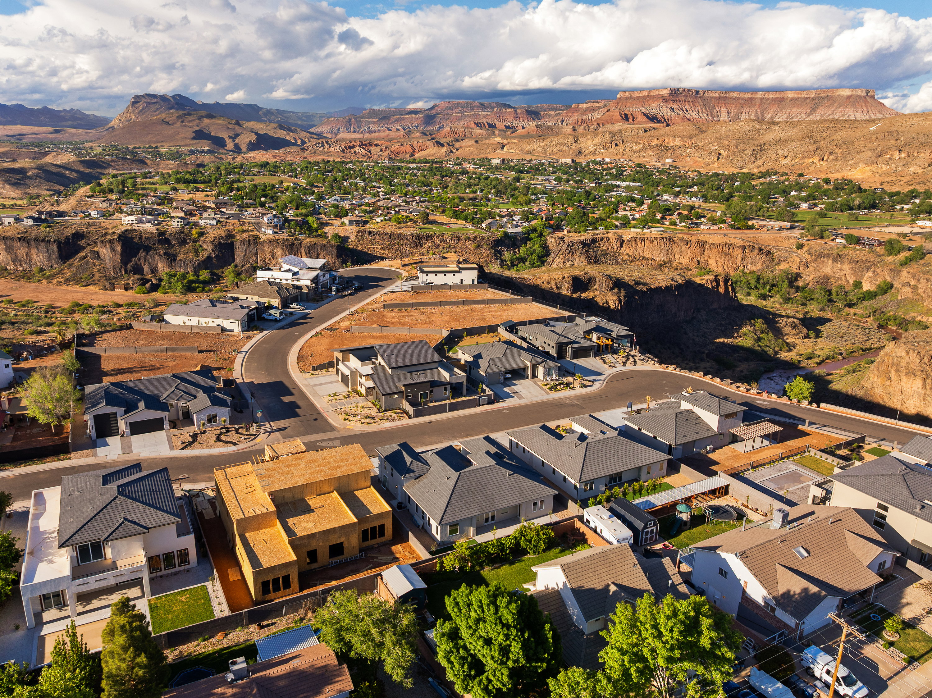 Aerial perspective of suburban area with a mountainous background