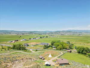 Overview of rural landscape featuring a mountain backdrop