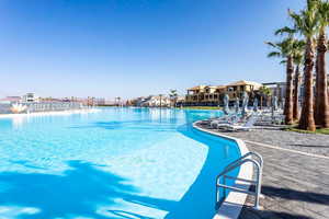 Community pool with a patio area