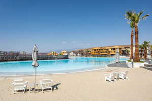 Community pool with a patio