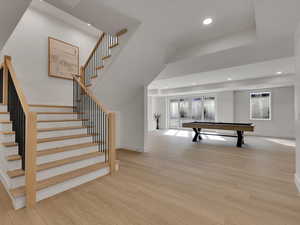 Game room featuring light wood-style floors, recessed lighting, pool table, and french doors