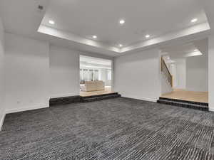 Basement featuring recessed lighting and carpet