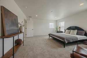 Bedroom featuring carpet and recessed lighting