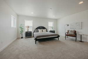 Bedroom featuring light carpet and recessed lighting