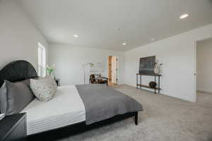 Bedroom with light carpet and recessed lighting