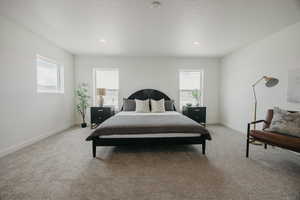 Bedroom featuring light colored carpet and recessed lighting