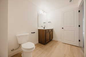 Bathroom with vanity and light wood-style floors