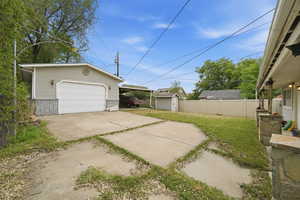 Garage featuring a shed and a garage