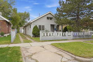 Bungalow with a fenced front yard