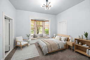 Carpeted bedroom featuring suspended lighting