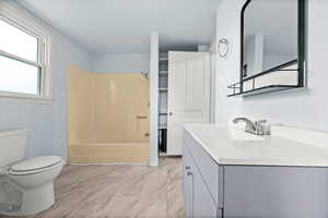 Full bath with vanity and shower / bathtub combination