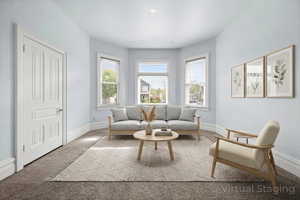 Living area with carpet floors and baseboards