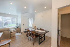 Dining space featuring light wood-type flooring and recessed lighting