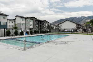 Community pool featuring a patio area and a mountain view