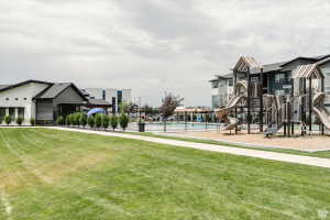 View of play area featuring a community pool